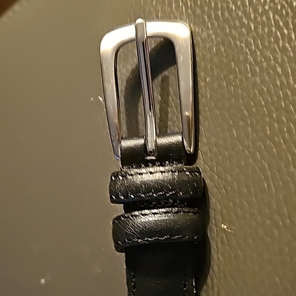 Black leather belt size XL. Silver buckle.  Very good used condition.